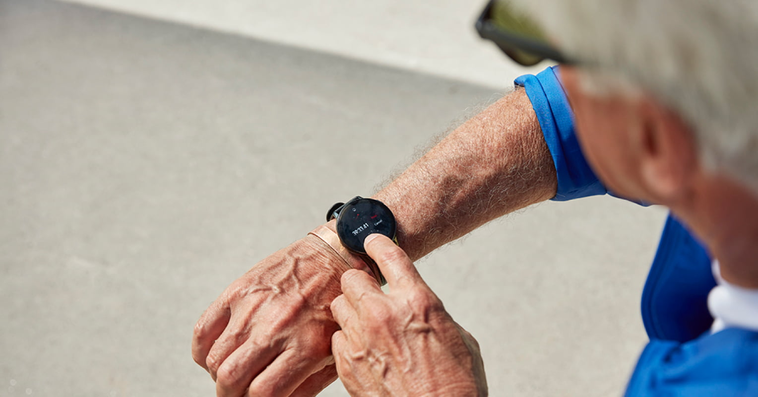 Elderly gentleman using a smartwatch