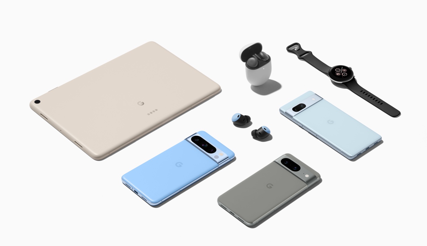 A neatly arranged selection of Google devices including a Pixel Tablet, three Pixel phones, a Pixel Watch, an opened Pixel Buds case and a pair of Pixel Buds