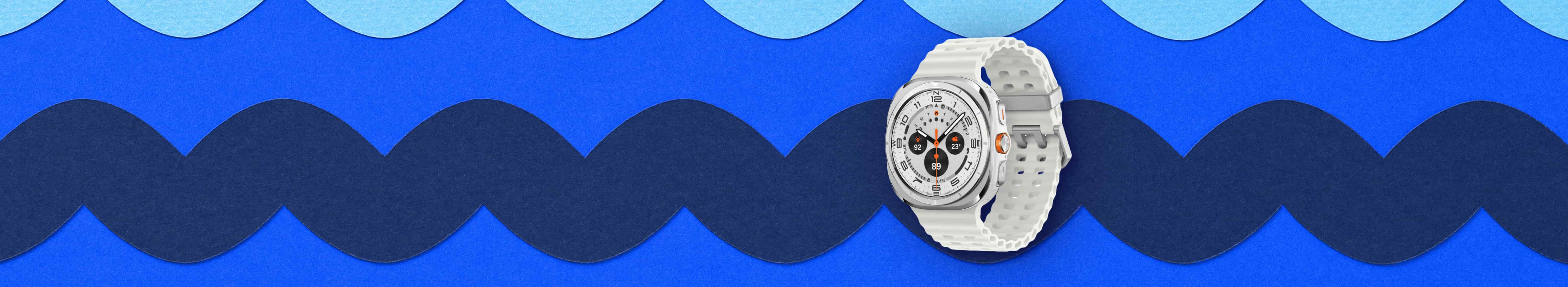 Front, three quarter angled view of Samsung Galaxy Watch Ultra 47mm with marine band sitting against blue patterned background.