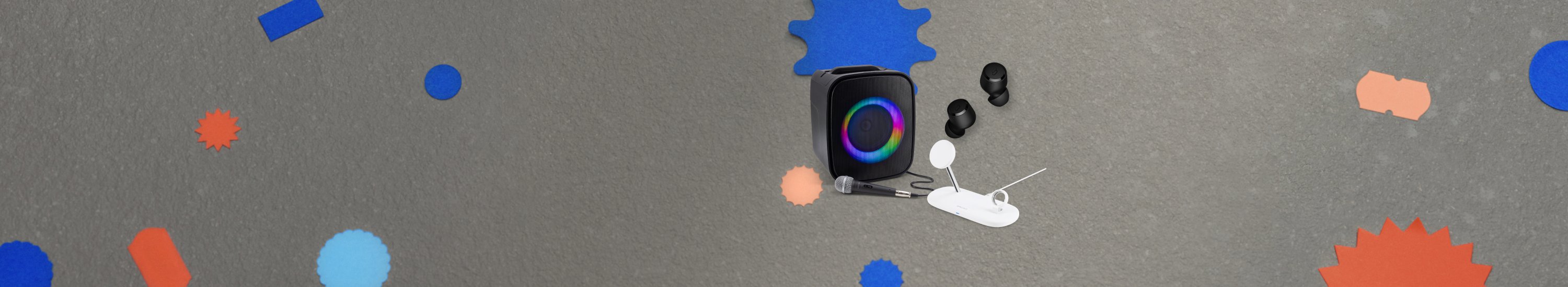 Image showing three Sprout accessories. Black Soundloop Party Speaker, white Qi2 Magnetic 3-in-1 Wireless Charger, and black Cadence 2.0 TWS Earbuds