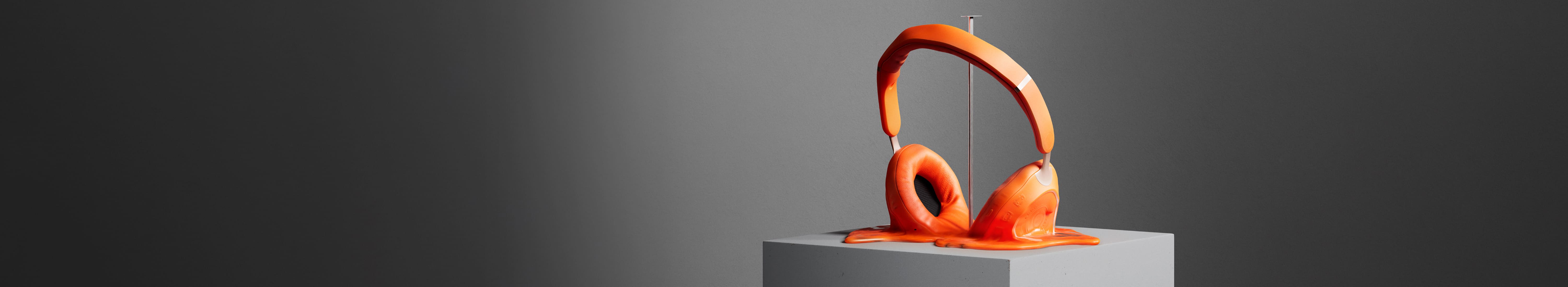 A surreal animation of orange headphones gradually melting into a puddle on a grey pedestal.