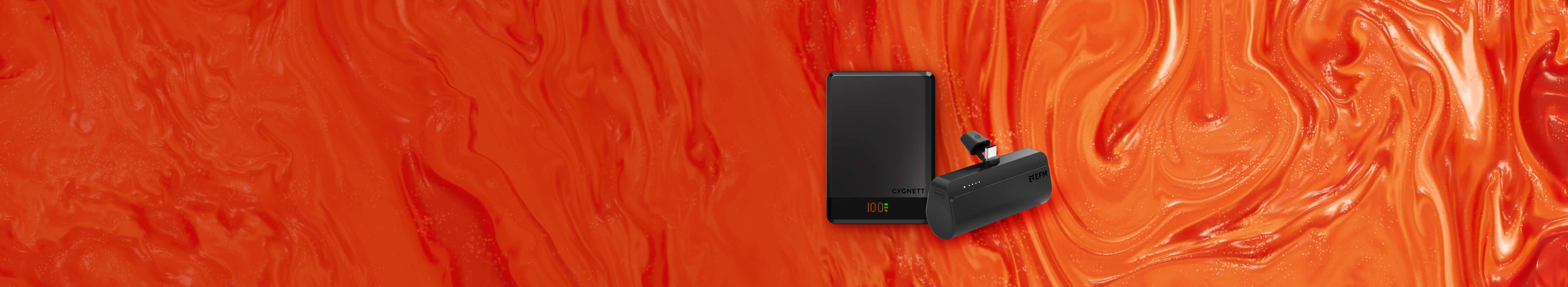 Flat lay of charging accessories shown against orange background. Left to right: black Cygnett Mag Slim 10k Powerbank, black EFM Power on the go 5k Powerbank.