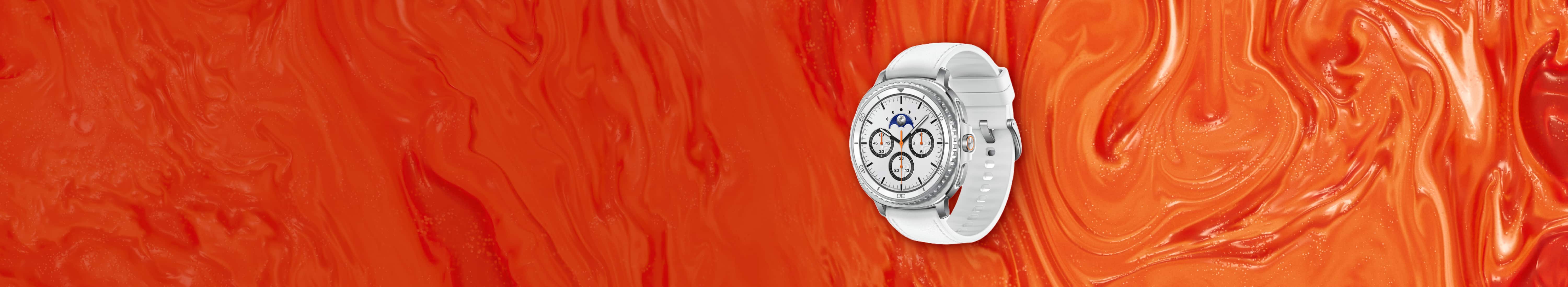 Flat lay image of Samsung Galaxy Watch8 Classic with white band against orange background. 