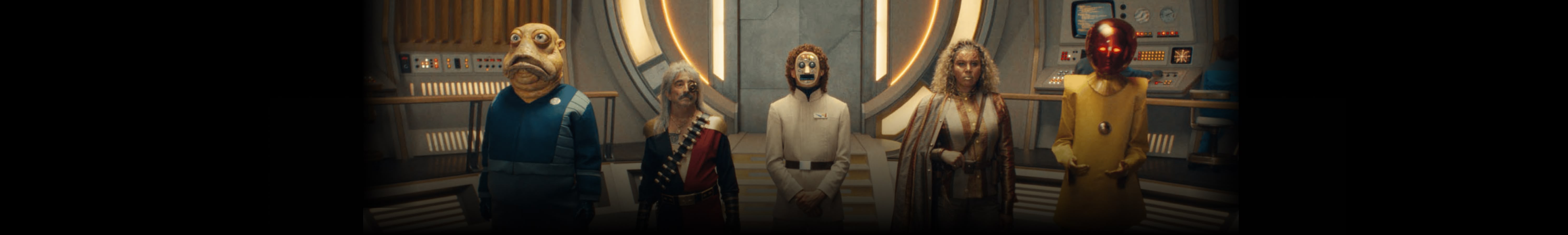 Several evil villains standing at attention inside a spaceship.