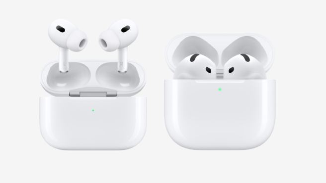 Two pairs of Apple AirPods displayed side by side in their charging cases. On the left, AirPods Pro 2 with a compact design, silicone ear tips, and shorter stems. On the right, AirPods 4 with longer stems and no silicone ear tips. Both cases are white with a front-facing LED indicator.