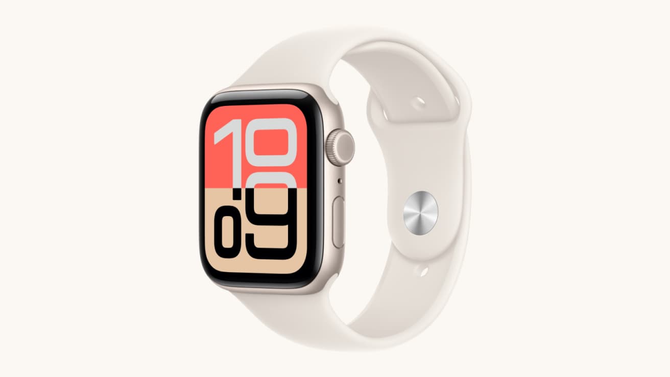 Apple Watch SE 3 with a silver case and white sport band, featuring a bold digital watch face with large red and beige numbers.