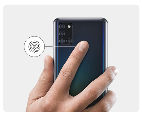 Someone using the fingerprint sensor on the Galaxy A 21 s.